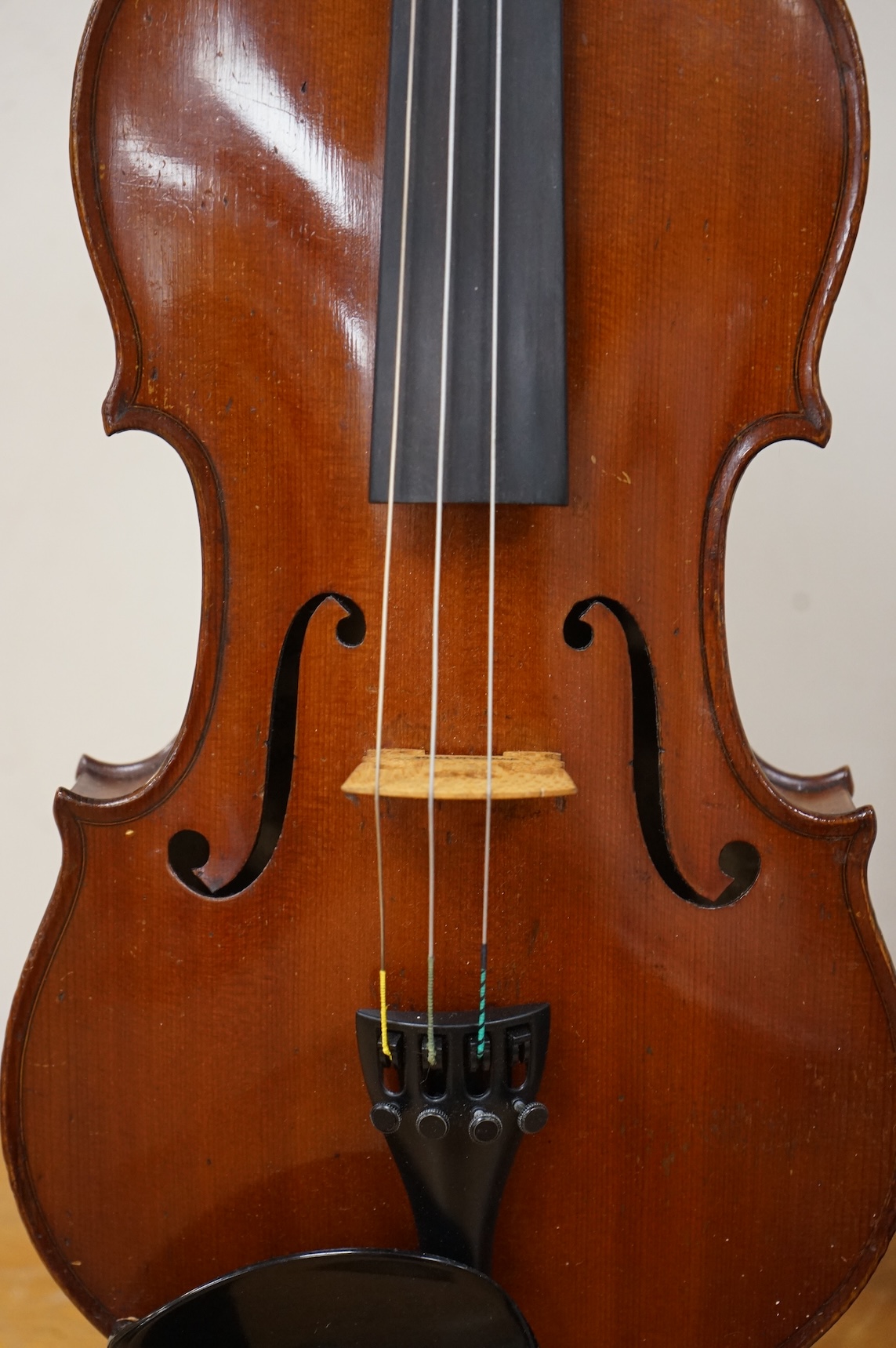 A cased late 19th century violin, signed ‘Nicolas Bertolini’, back 36.3cm, with bow stamped Paesold, CITES Submission reference, D9GSYMLJ